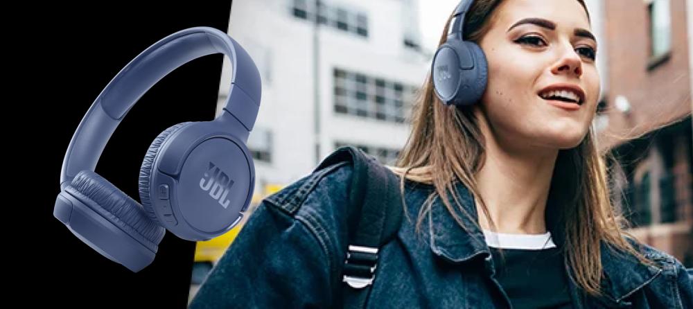 Girl wearing JBL wireless headphones, enjoying premium sound on the go.